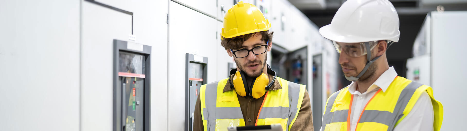 Two Engineer working and check status switchgear electrical energy distribution