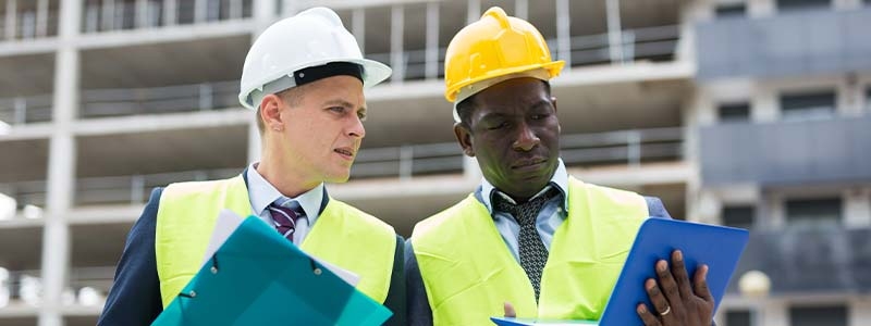 A group of men wearing hard hats