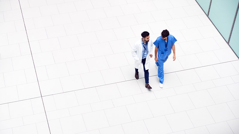 A couple of doctors walking