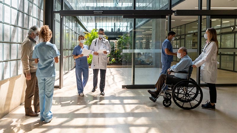 A group of people in scrubs and face masks