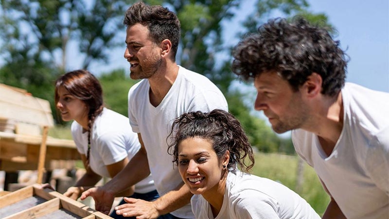 A group of people in white shirts