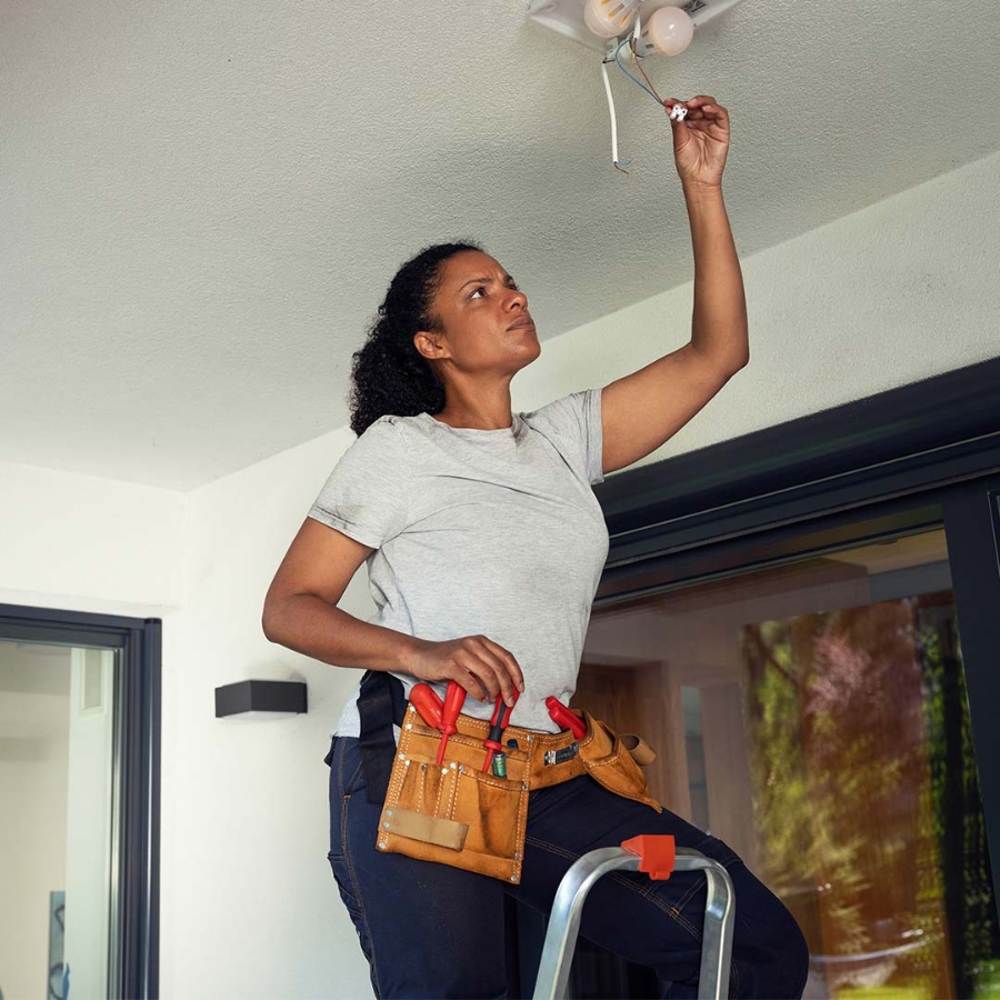 Electrician women doing a connection