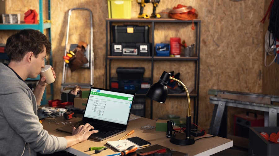 Man in small office on laptop