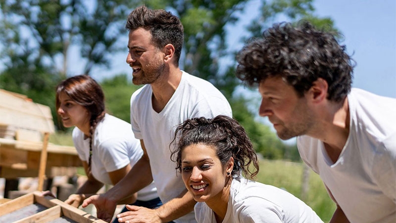 A group of people in white shirts