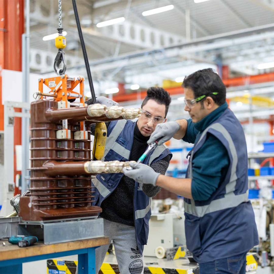 A group of men working on a machine