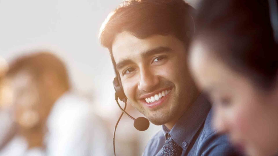 man wearing headset smiling