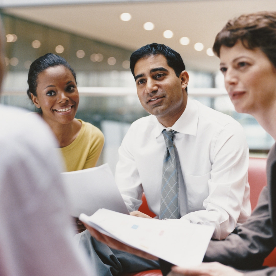 people in conversation at office