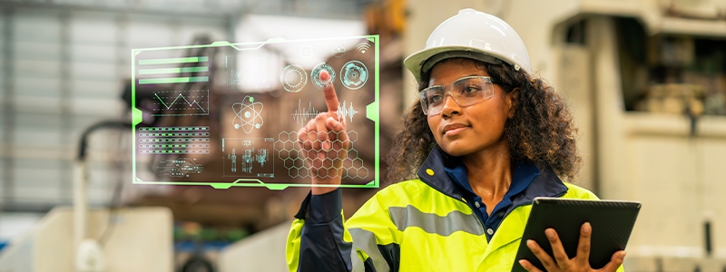 Female engineer working on digital tablet and digitalization display in the production area. She had a development program for use in the automobile industry. Production improvement concepts - Getty stock photo