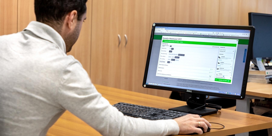 member of panel builder team configuring medium voltage switchboard using online software