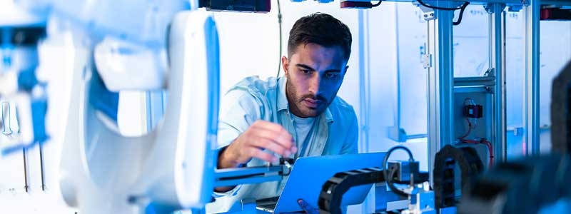 Caucasian Engineers Maintenance Robot Arm at Lab