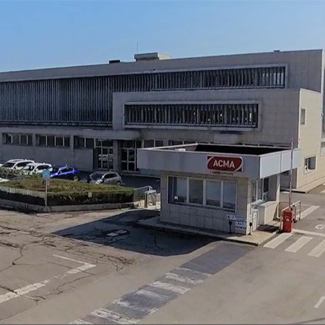 A building with a parking lot and a parking lot