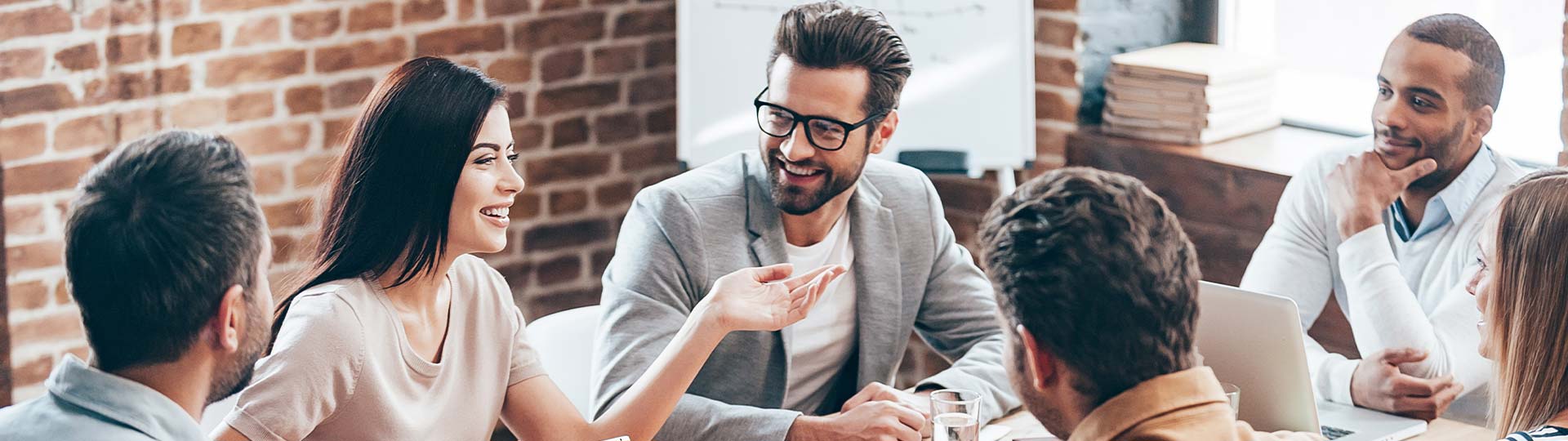 A person in glasses talking to a person