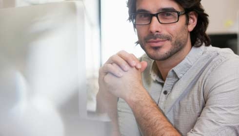 Close up portrait of smiling businessman wearing eyeglasses