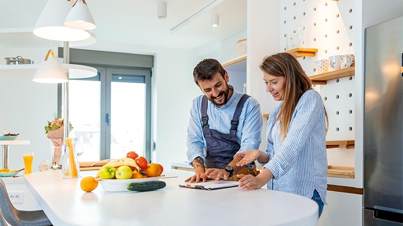 A person and person in a kitchen