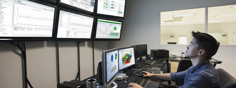 Chinese businessman working in control room