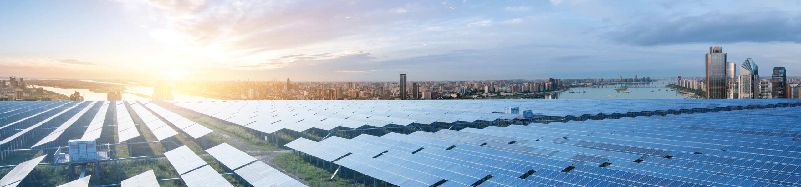 Eco-environmentally friendly green energy of sustainable development of solar power plant with Shanghai skyline.