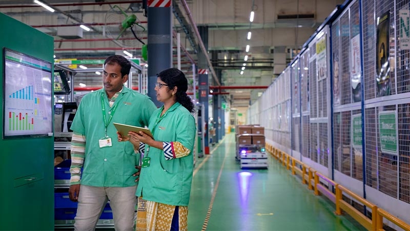 A person and person in a factory