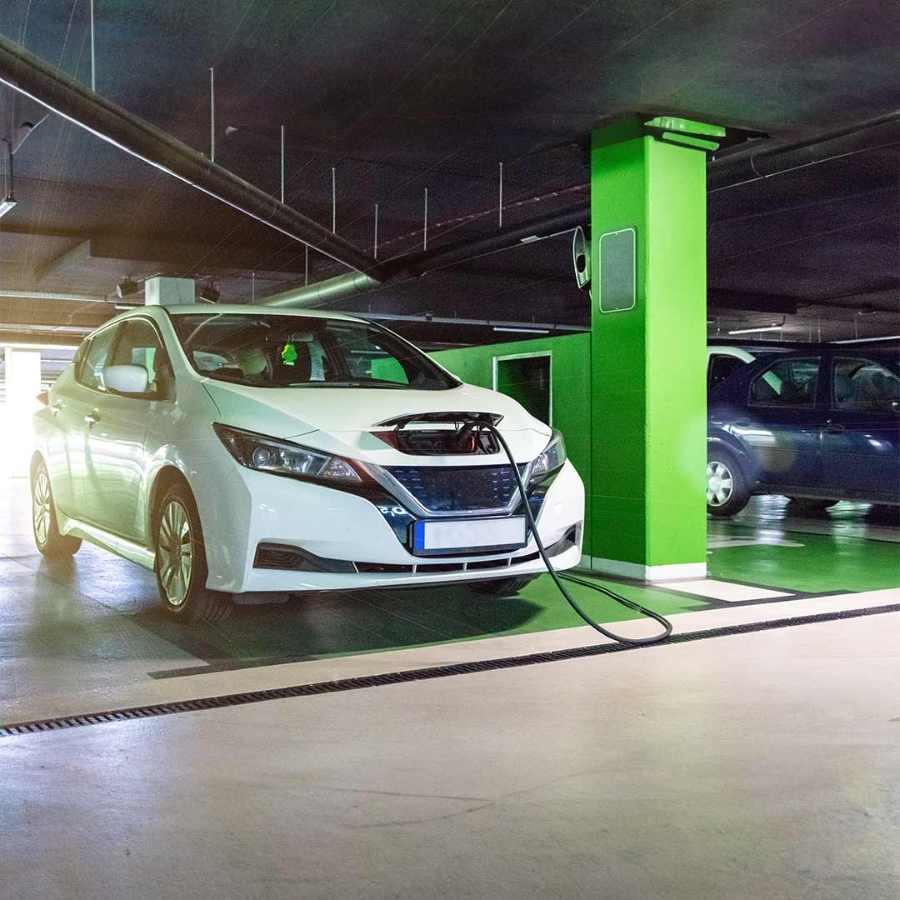A car charging at a parking garage