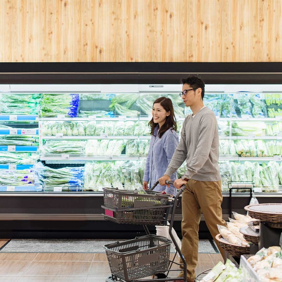 A person and person shopping in a grocery store