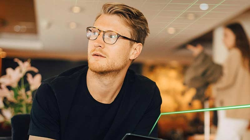 Closeup of a young man wearing glasses