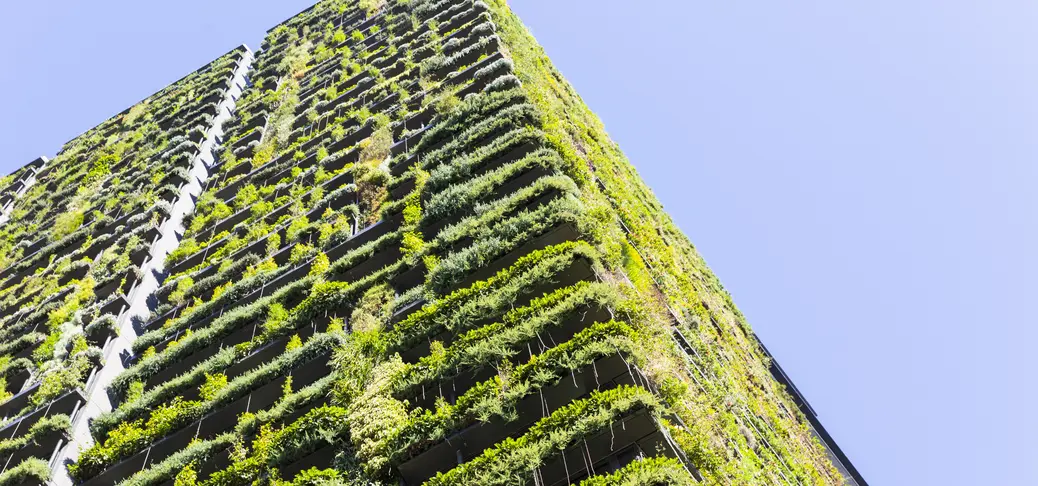 Low angle view of apartment building with vertical garden