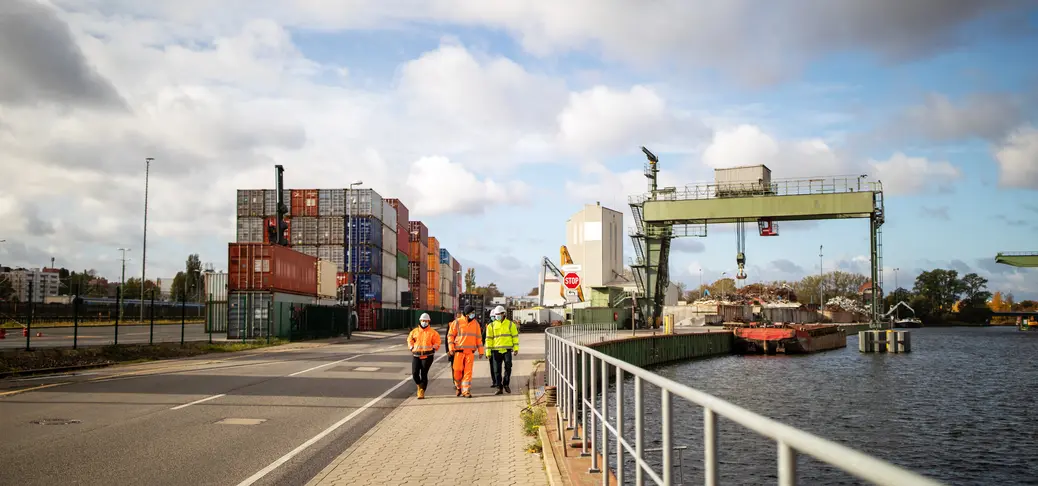 Commercial dock jetty with employees walking along the road