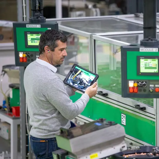 A specialist looking at a tablet