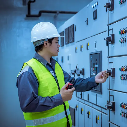 A panel builder doing maintenance to avoid electrical hazards