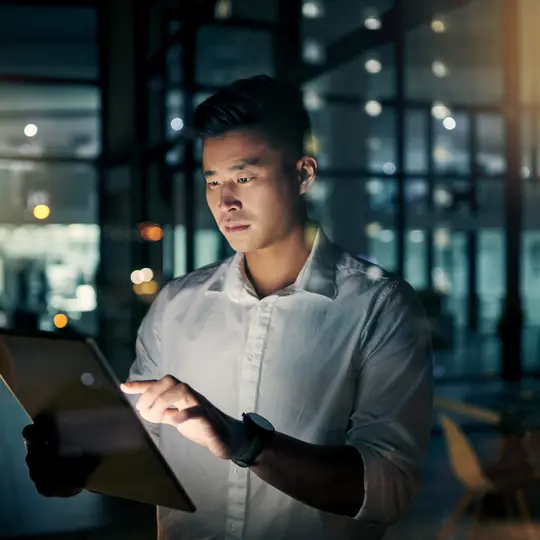 A young businessman using a digital tablet