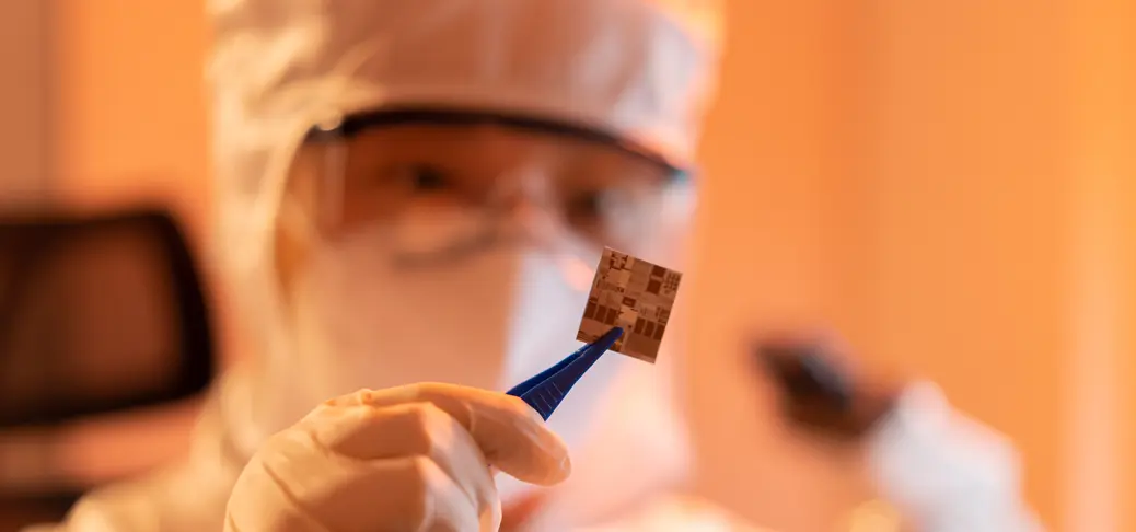 Engineer inspecting semiconductor chip