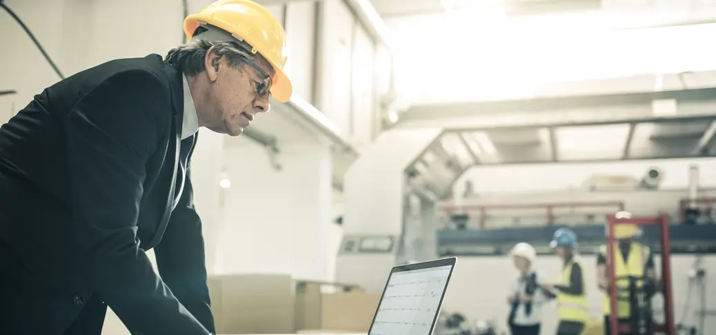 An architect using computer at the construction site