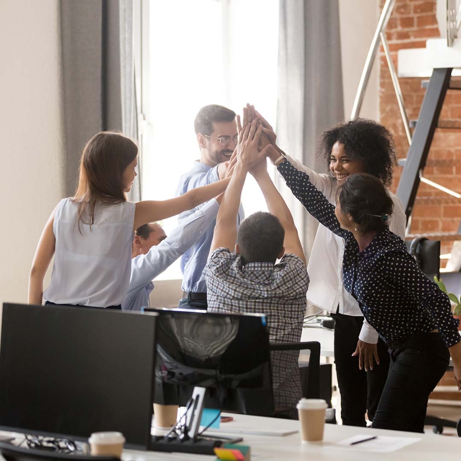 A group of employees celebrating in office