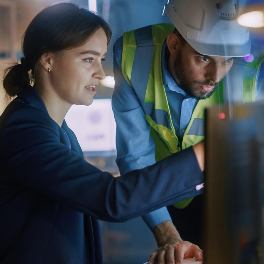 A person and person looking at a computer screen