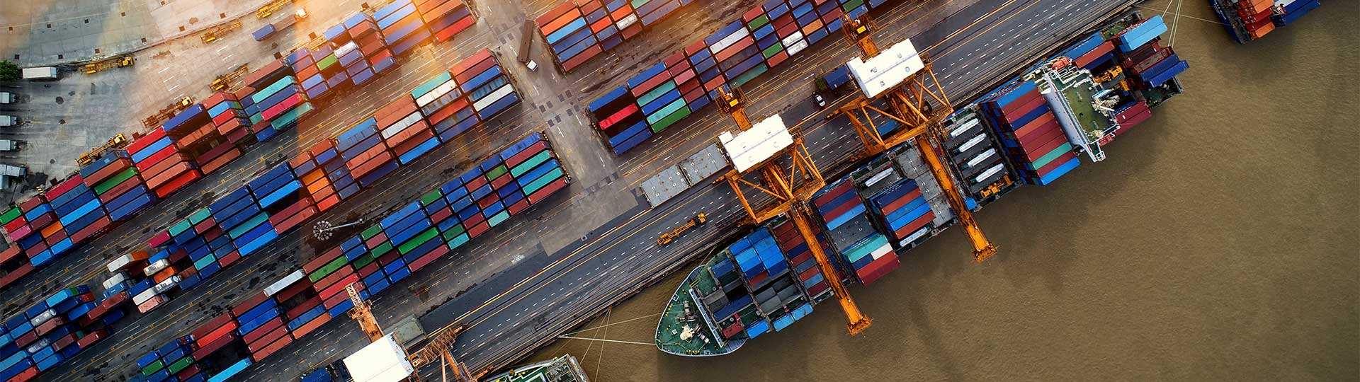 A container ship carrying cargo in a smart port