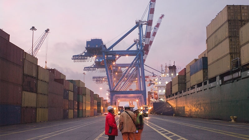 maintenance team discusing the performance of the shipping yard infrastructure