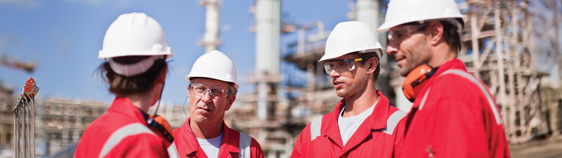 a group of men wearing hard hat