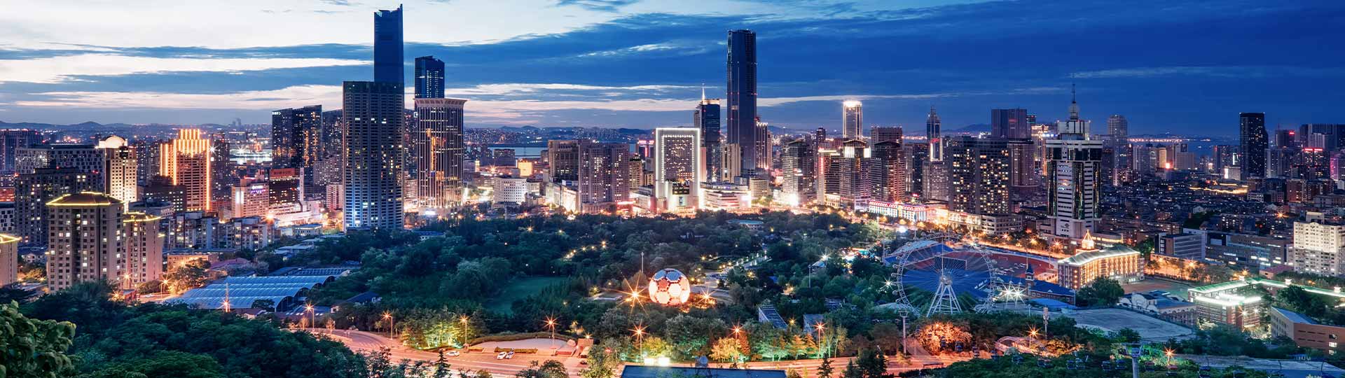 An illuminated modern cityscape powered by reliable electric utilities.