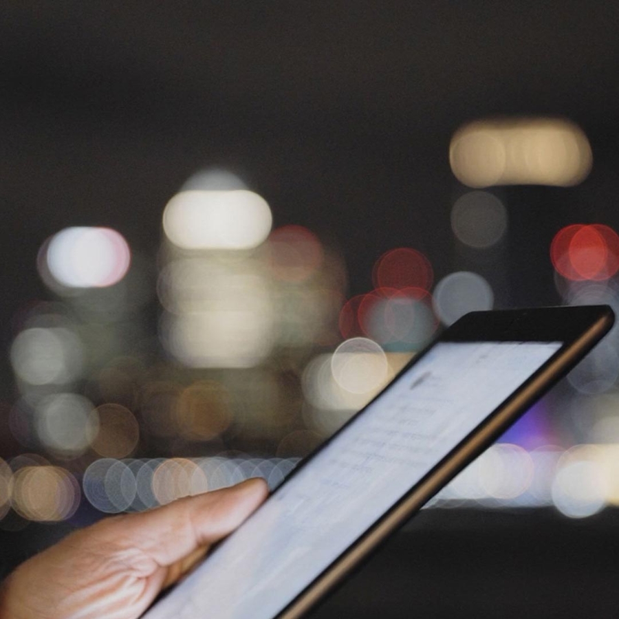 A person holding a tablet