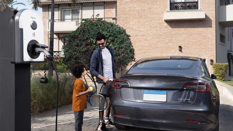 Man and child on charging station