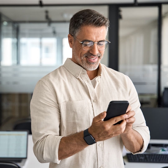 Man operating mobile phone