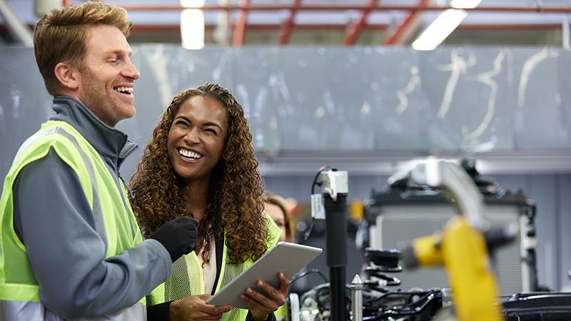 A person and person in a factory