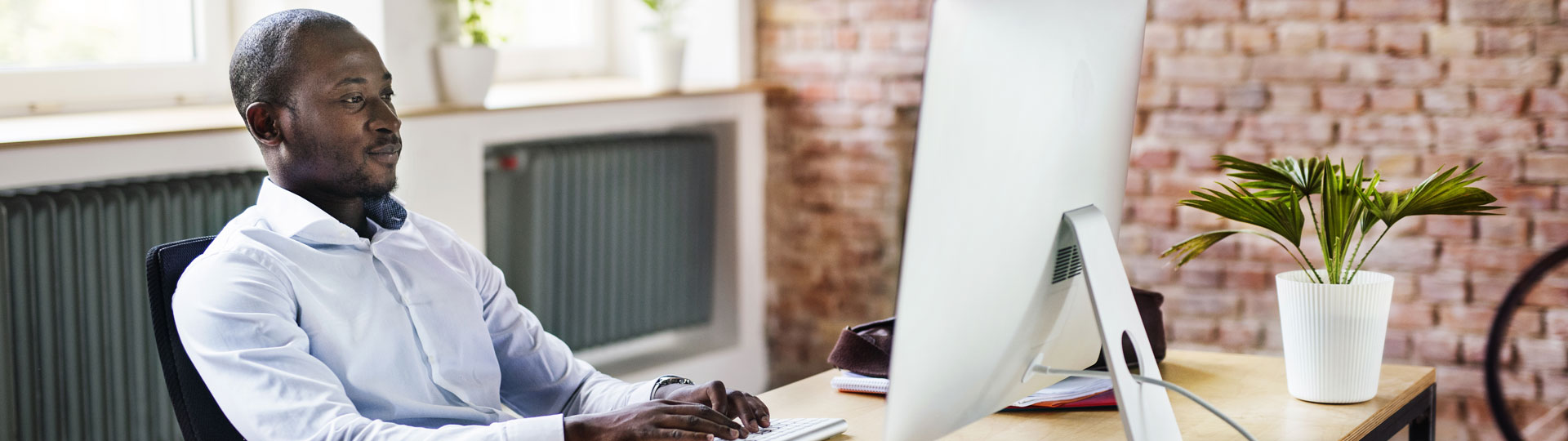 African Man working on computer