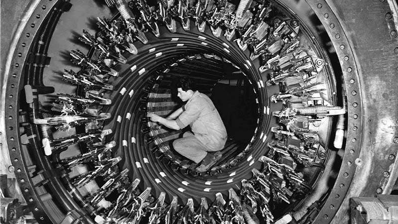 A person working on a spiral staircase