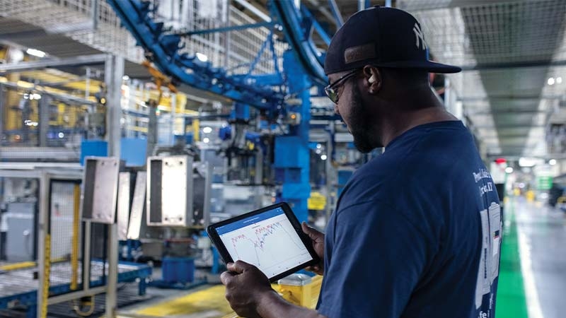 A person holding a tablet