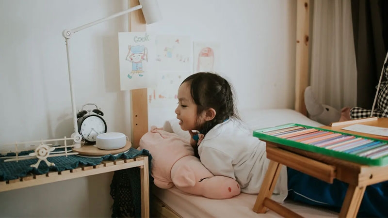 A child lying on a bed