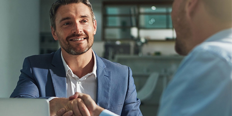 Two Man shaking hands in office