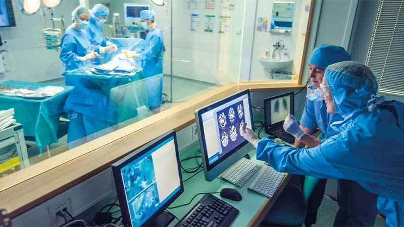 A group of doctors working on computers