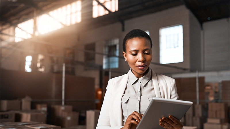 Shot of a factory manager using a digital tablet in a warehouse