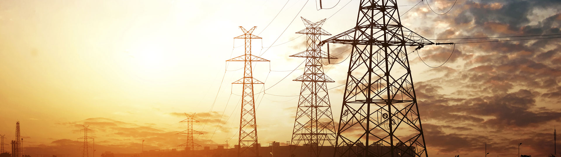 Electricity transmission towers during sunset