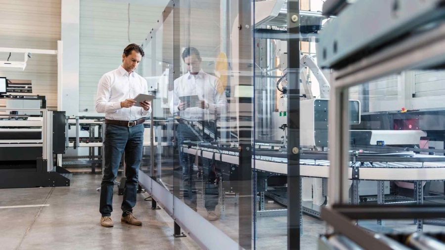 man with a tablet in the factory